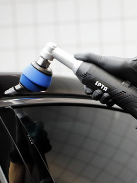SPTA hand holding pads to show scale for precise detailing reach