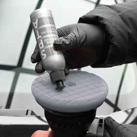 SPTA bottle in hand to show 120ml scale and ease of storage
