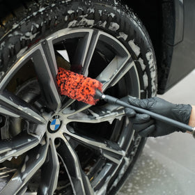 SPTA cleaning a polished rim showing scratch-free finish protection