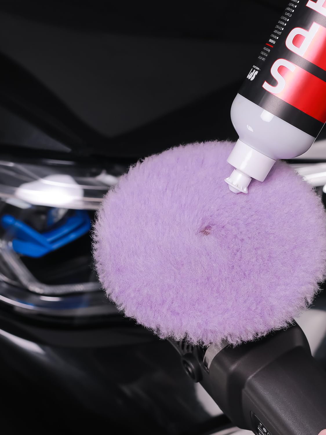 SPTA pad in a detailing bay demonstrating professional polishing workflow