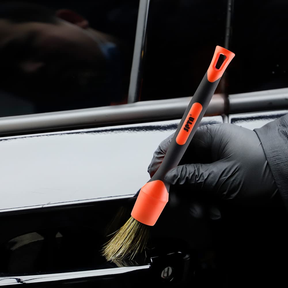 SPTA detailing kit staged on car hood for professional finishing