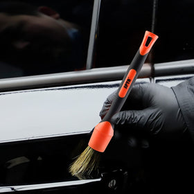 SPTA detailing kit staged on car hood for professional finishing