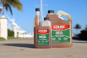 STA-BIL bottle stored on garage shelf indicating bulk supply readiness benefit.