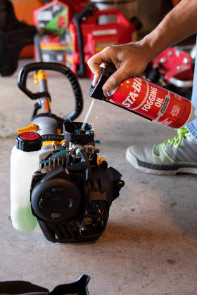 STA-BIL in a garage protecting a stored lawnmower engine from rust