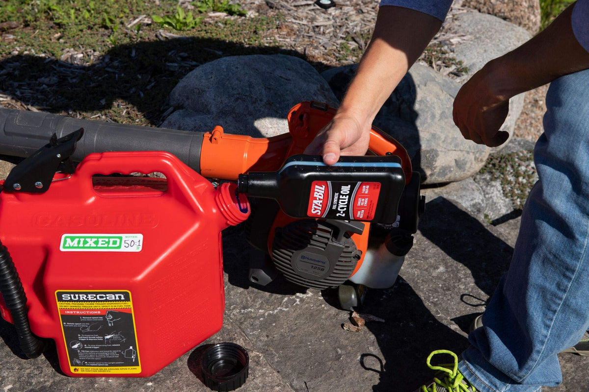 STA-BIL used with a chainsaw outdoors for reduced smoke and clean runs