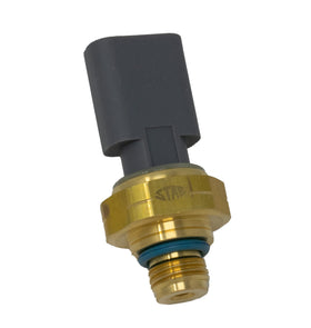 Stab Motorsports sensor held in hand for scale showing compact, serviceable size