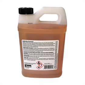 Measuring cup with Stanadyne illustrating precise dosing to treat 500 gallons