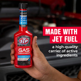 STP bottle pouring into fuel filler demonstrating easy dosing benefit