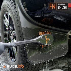 suds.lab brush cleaning a wheel well removing road grime efficiently