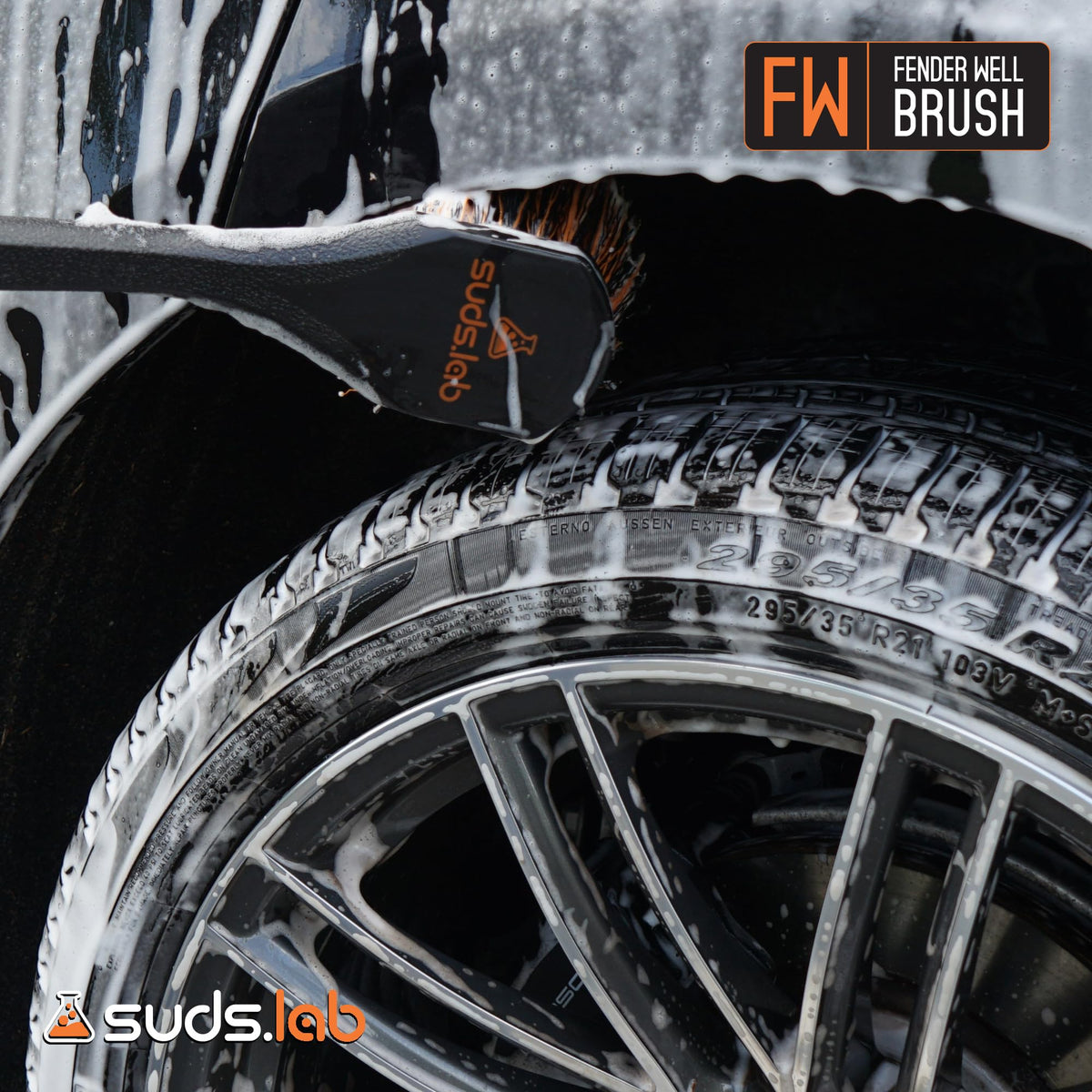 suds.lab brush beside tape measure showing 18-inch length for scale