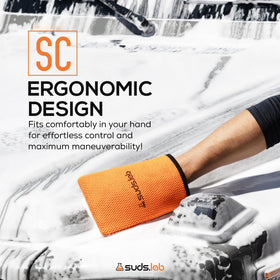 suds.lab mitt rinsed under tap for easy maintenance and reuse
