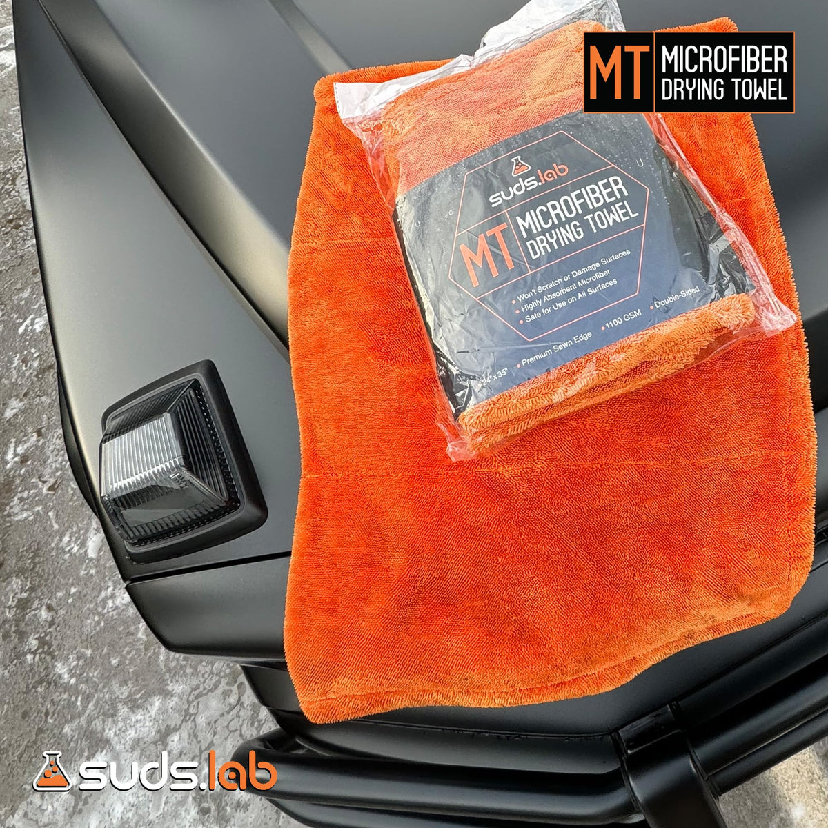 suds.lab towel on workbench in garage conveying professional detailing readiness benefit