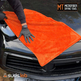 suds.lab towel in washing machine showing easy-care and durability benefit