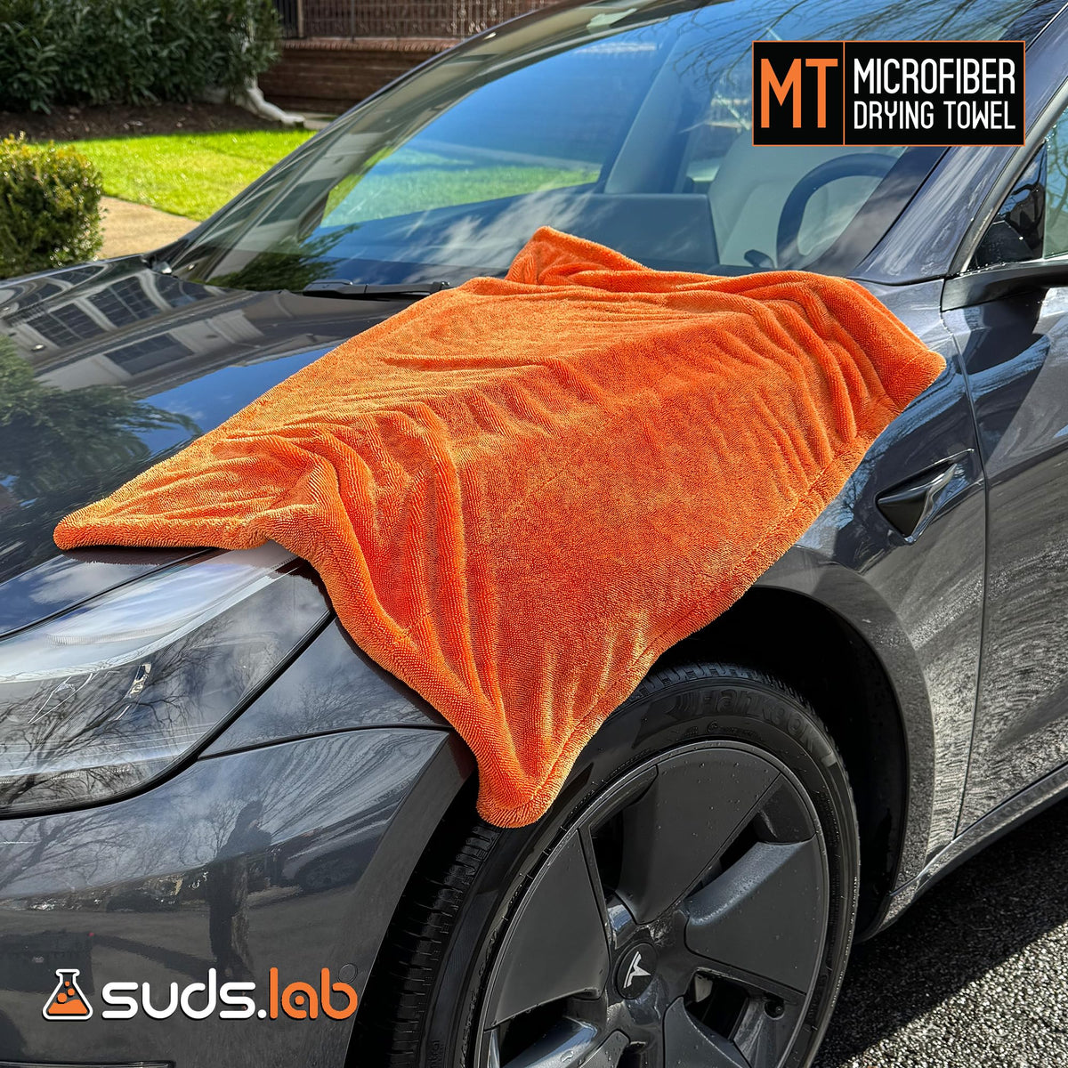 suds.lab towel wiping glass for streak-free visibility benefit