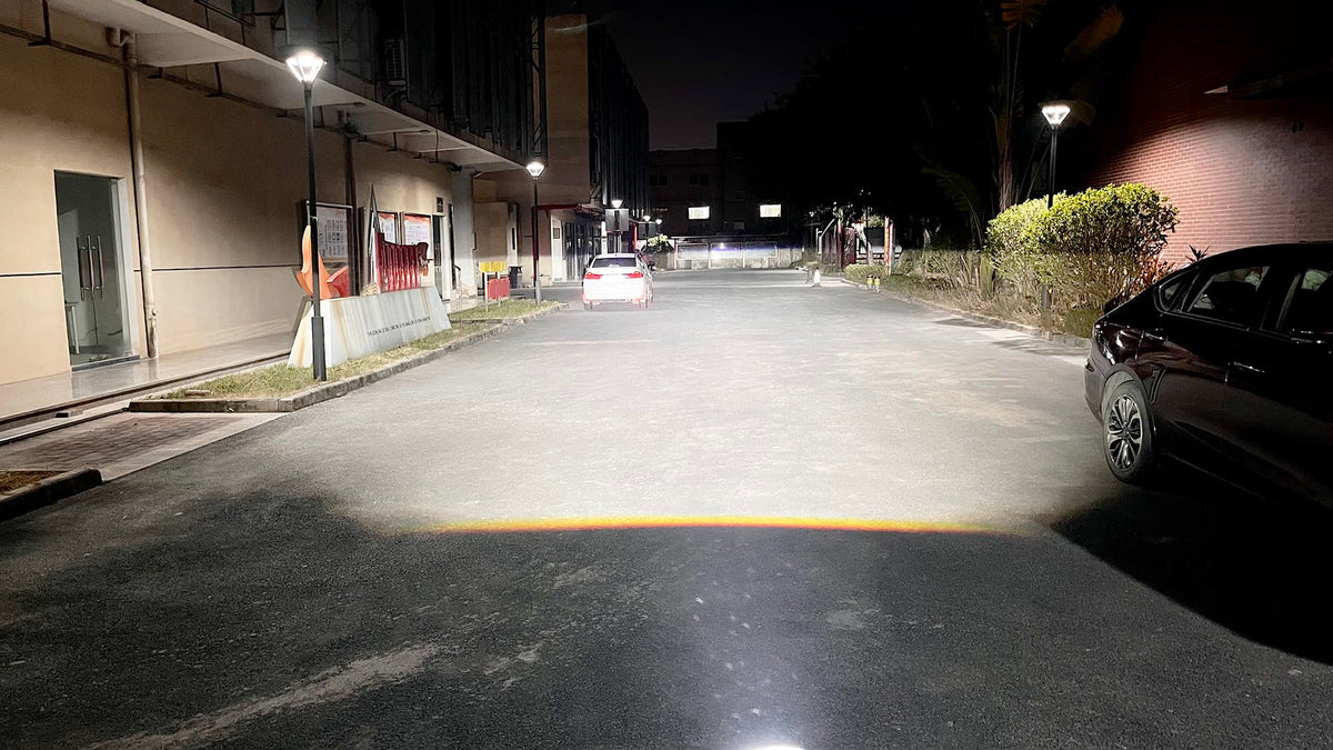 SUFEMOTEC nighttime beam pattern photo showing focused, wide illumination and fog penetration benefit