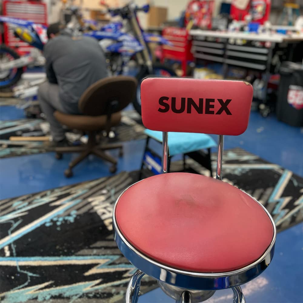 Sunex Tools stool next to toolbox showing compact footprint and scale