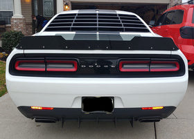 Sunluway lifestyle shot driving Dodge Challenger emphasizing sporty aesthetic benefit