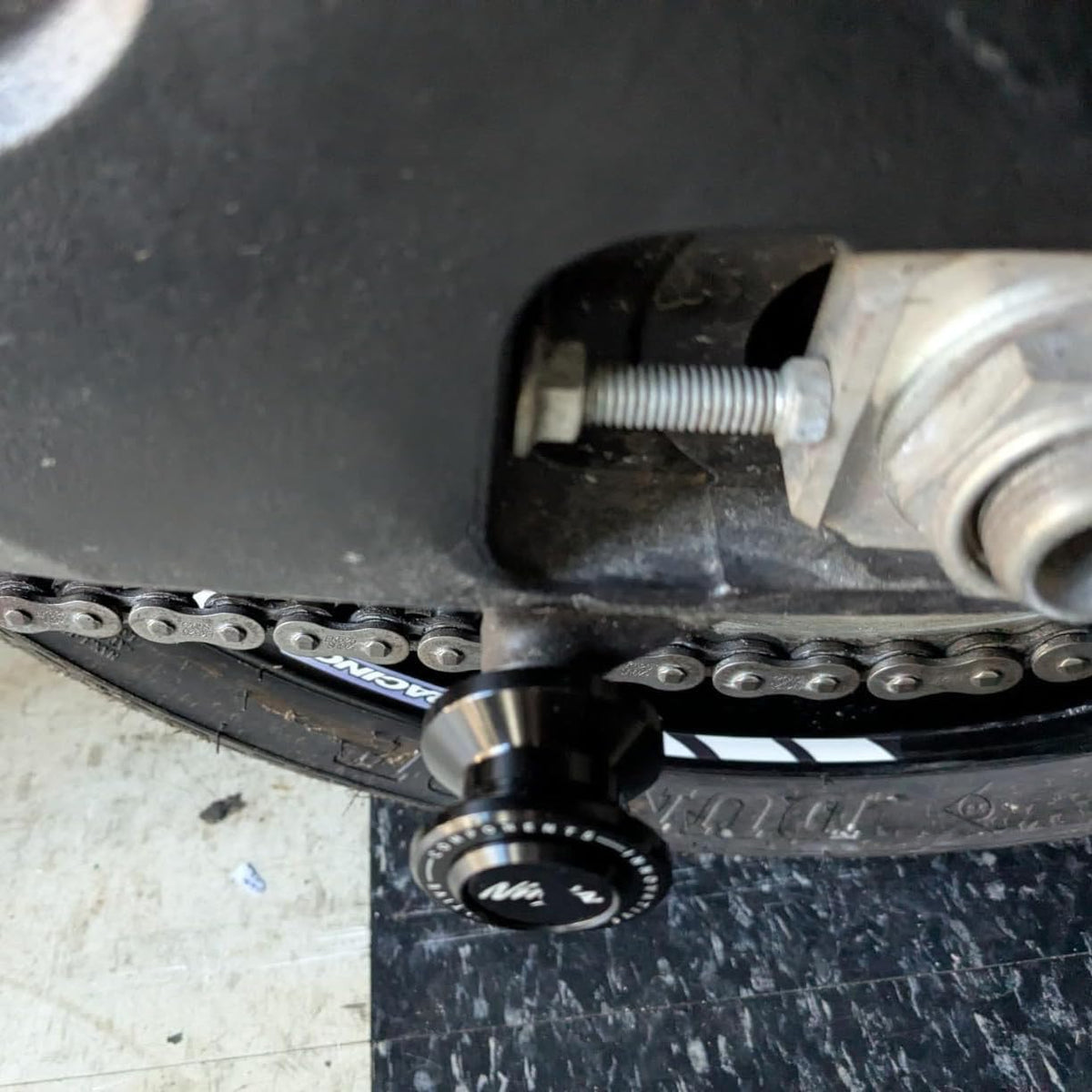 Super Vici spool with paddock stand in use demonstrating safe rear-wheel elevation