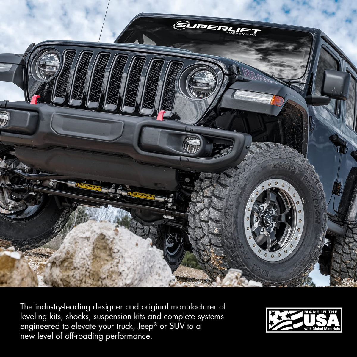 Superlift on off-road truck in action showing improved steering stability on rough terrain