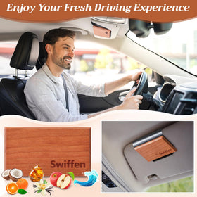 Swiffen hanging on car sunvisor with aftermarket clip showing hands-free scent dispersion while driving