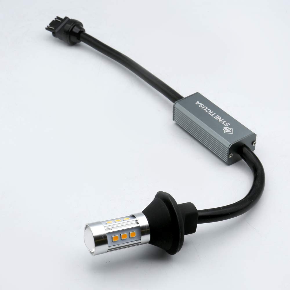 Syneticusa lit amber turn signal in use showing enhanced daytime visibility