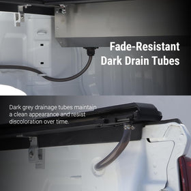 Syneticusa close-up of integrated drain tube directing water away from truck bed