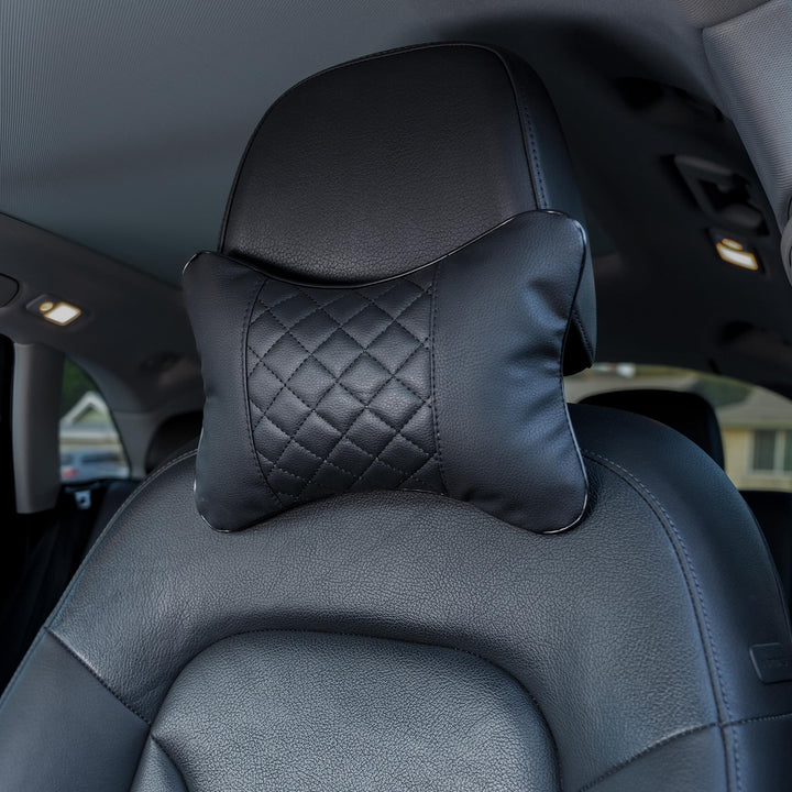 Synterior front view of two black headrest pillows showing coordinated style and comfort