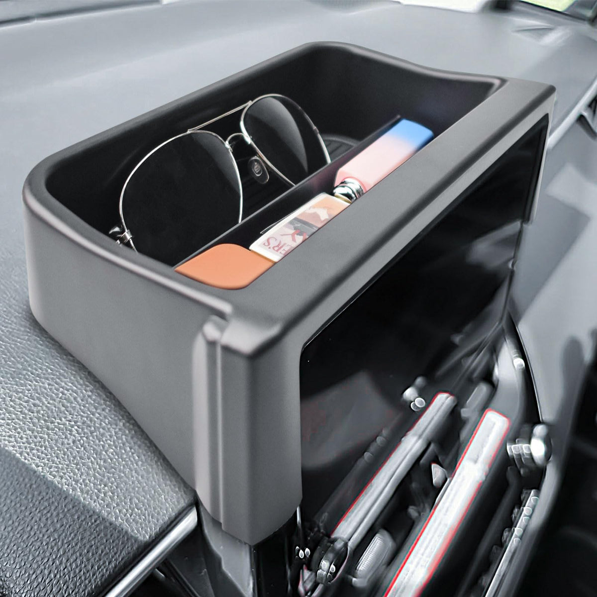 TACOBRO lifestyle shot inside car showing organized cabin benefit