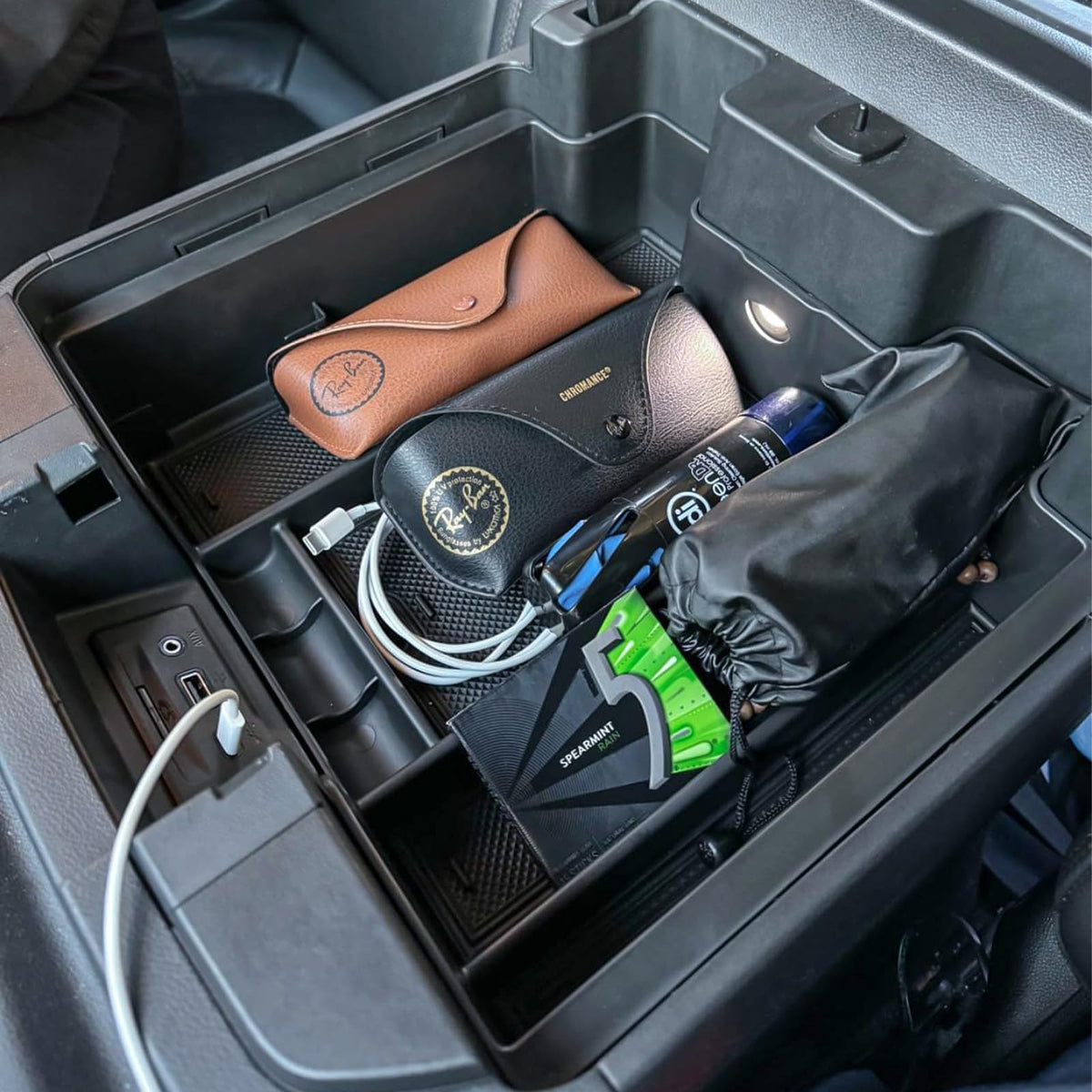 TACOBRO lifestyle shot inside truck cabin illustrating tidy storage and reduced clutter