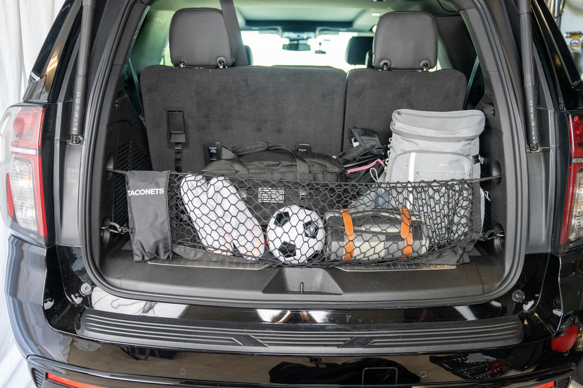 TacoNets holding grocery bags in SUV cargo to prevent spills and shifting benefit