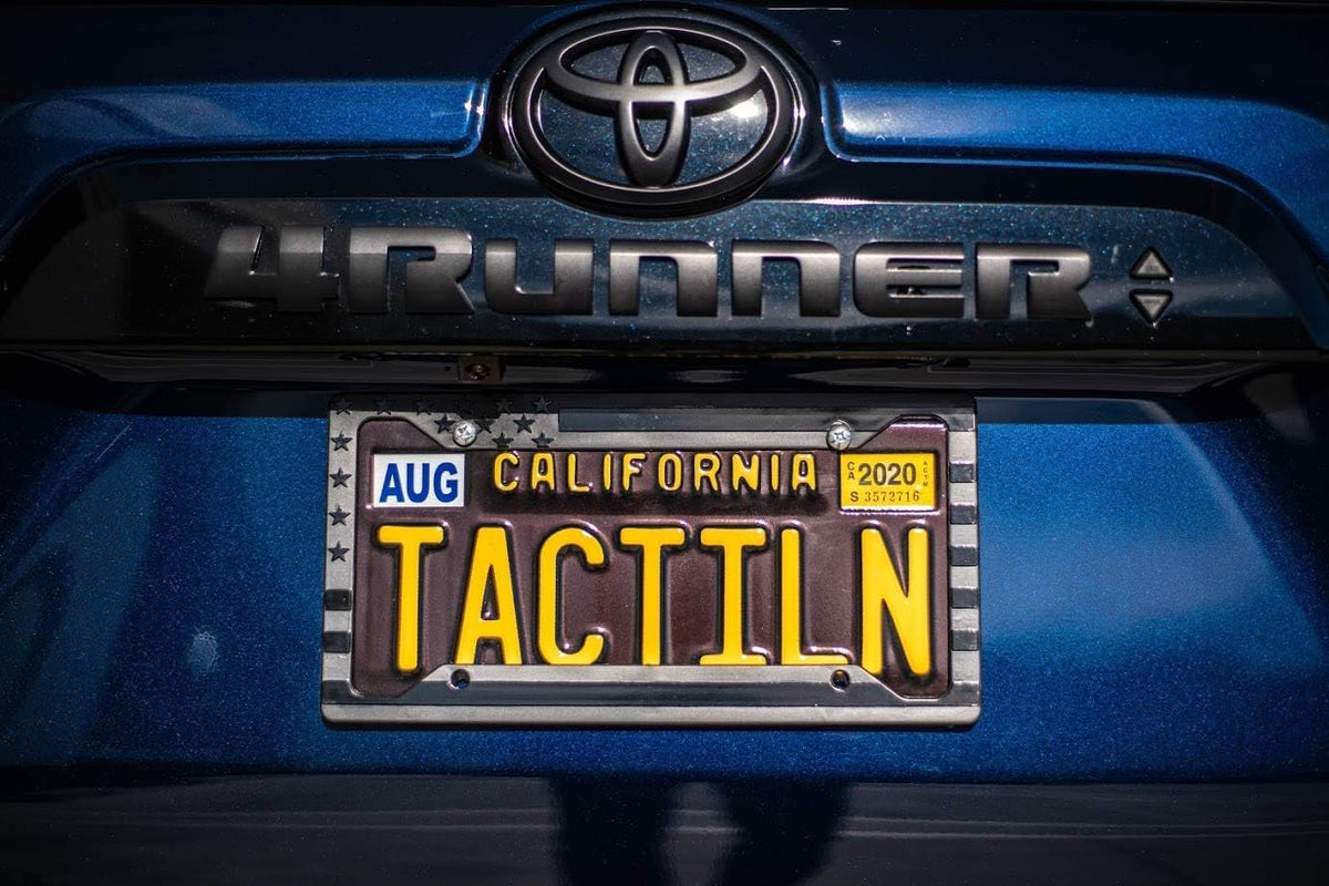 TACTILIAN frame beside standard license plate showing universal fit