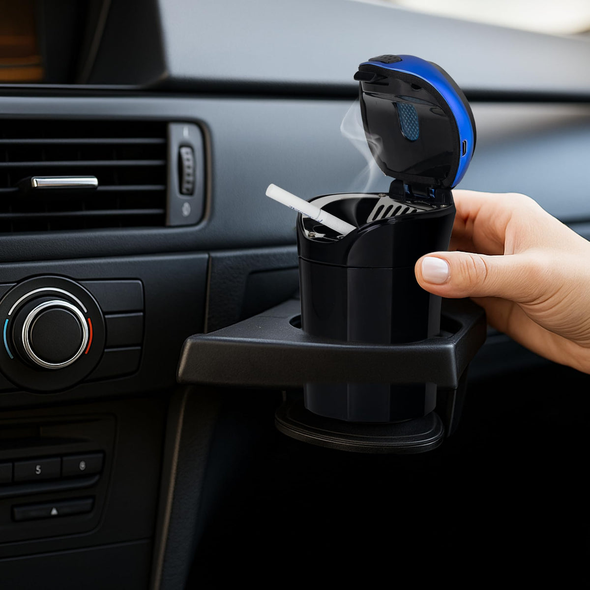 TAKAVU ashtray in nighttime driving scene showing ambiance and reduced fumbling benefit