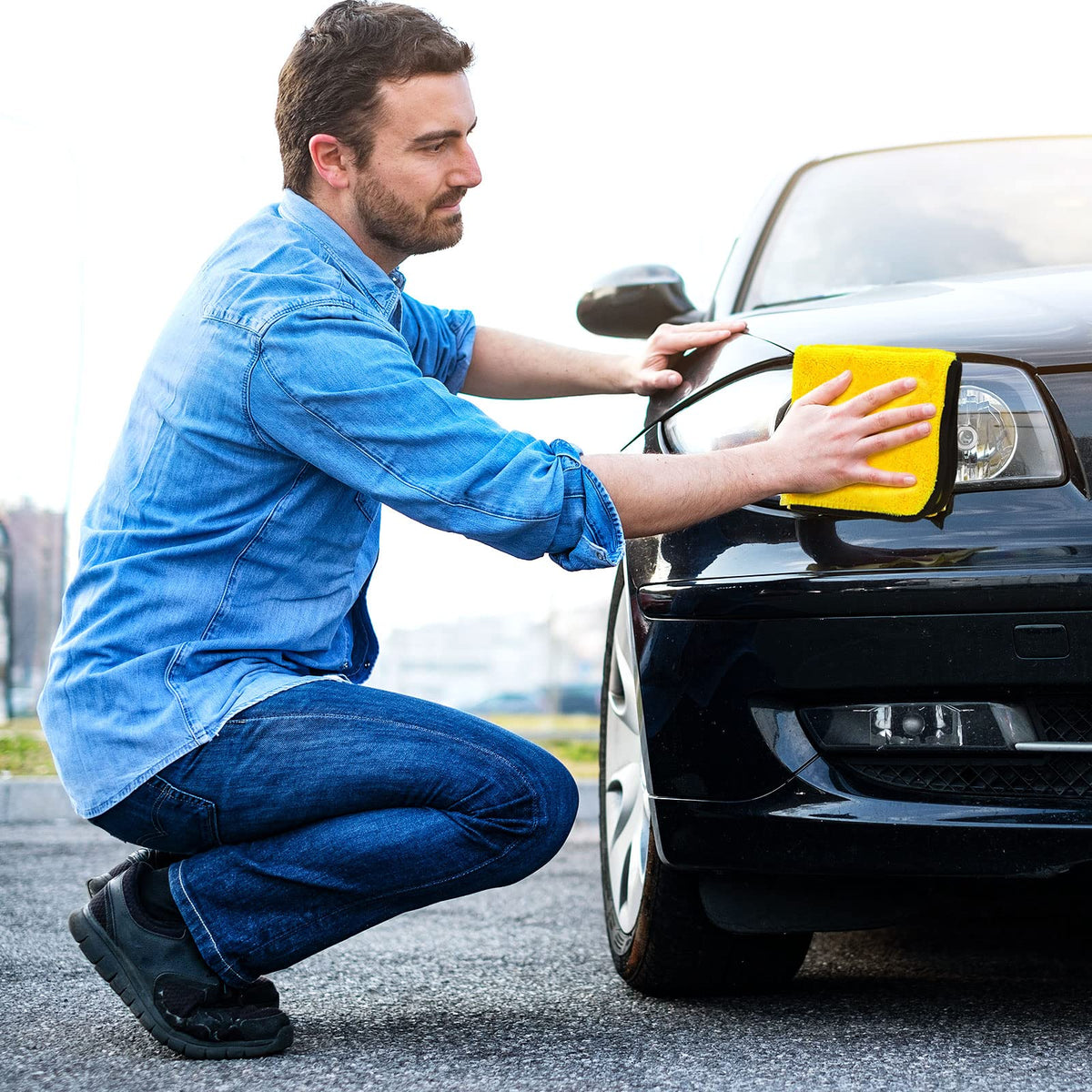 Tallew buffing a car hood to reveal shine without scratches