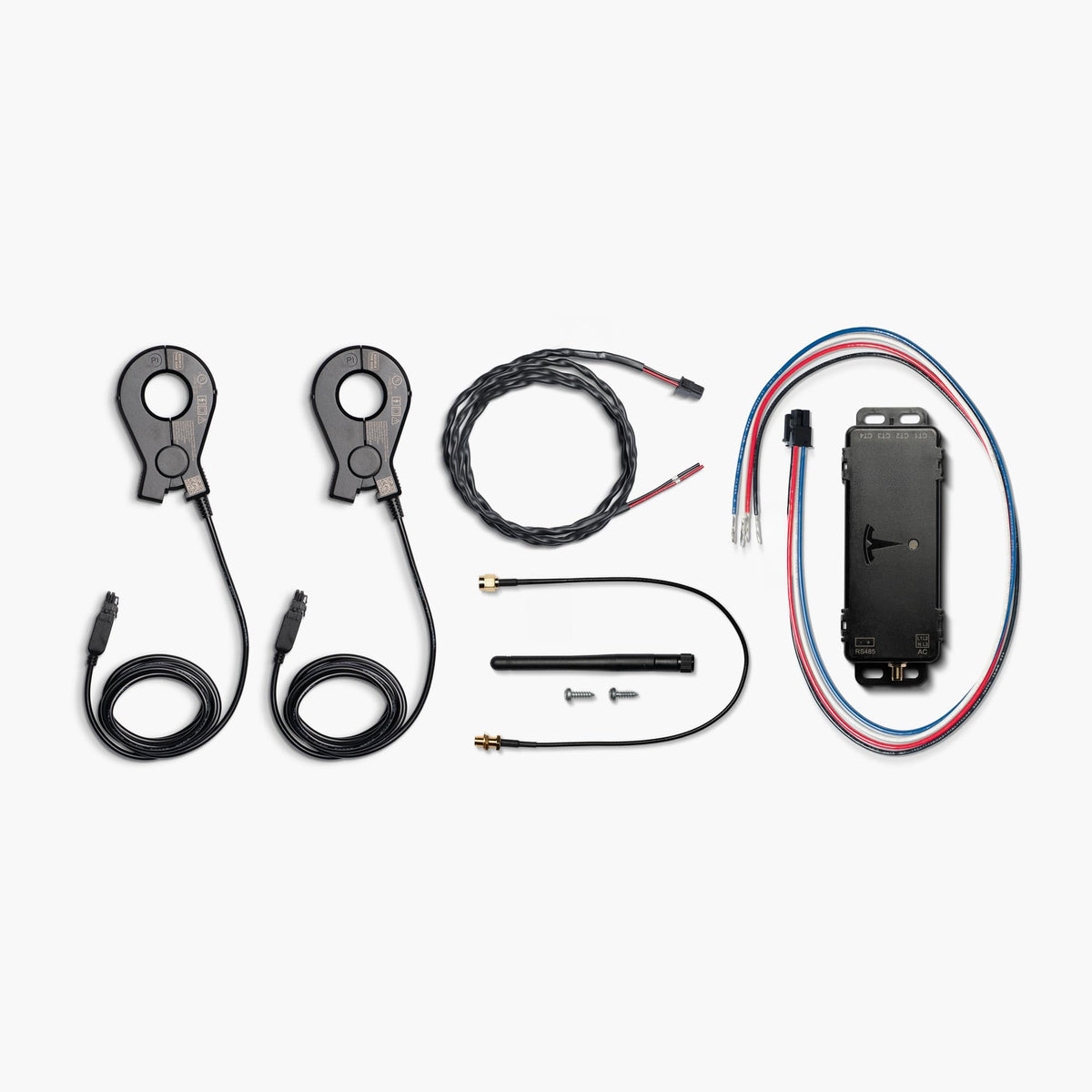 Tesla Remote Meter close-up of included 200A current transformer and RS-485 harness for accurate load sensing