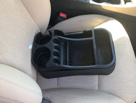 Texas Saddlebags console beside a water bottle showing compact size for space-saving
