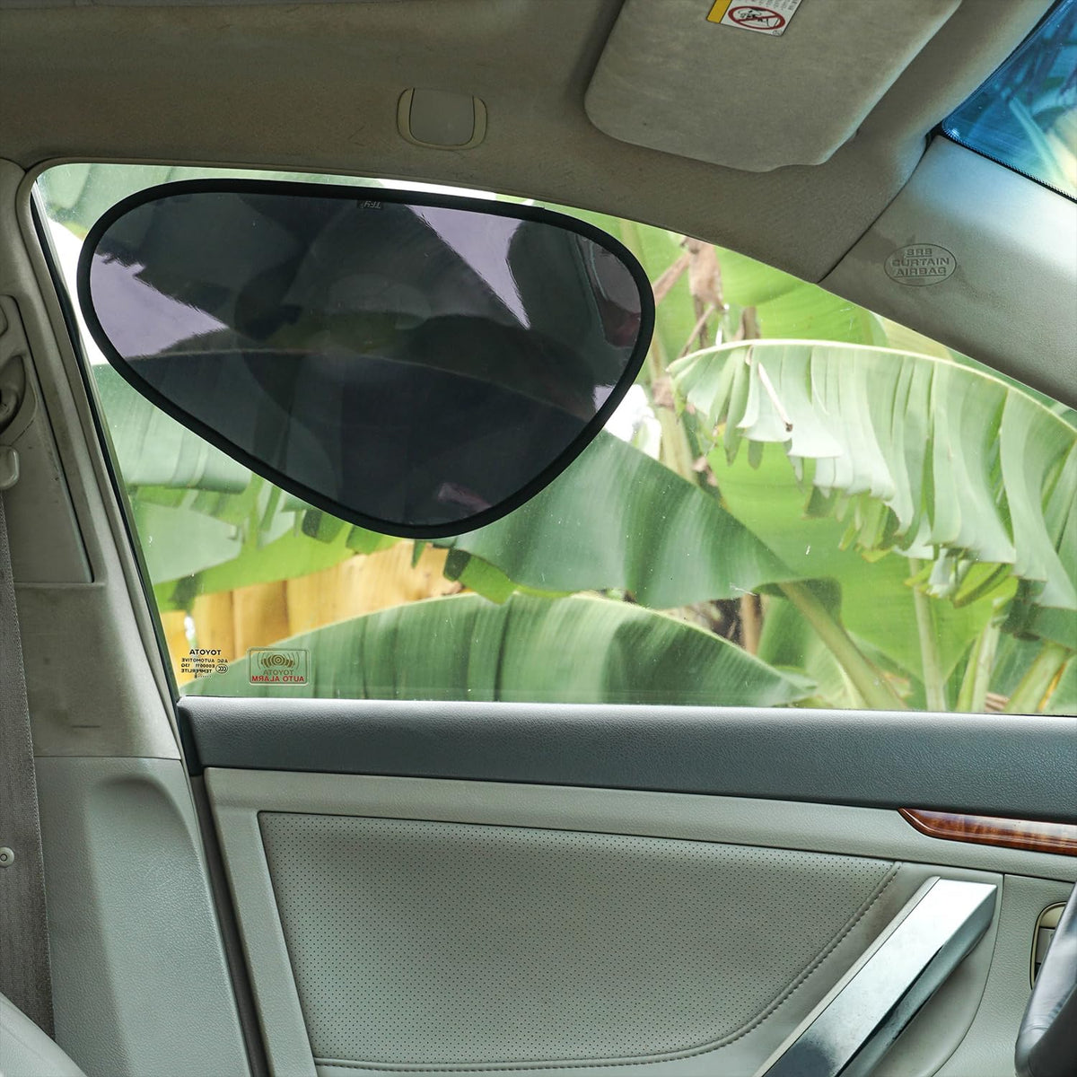 TFY sun visor extender installed on a car side window demonstrating glare reduction while driving
