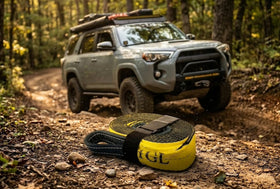 TGL strap used as a tree saver wrapped around trunk protecting bark during winch use