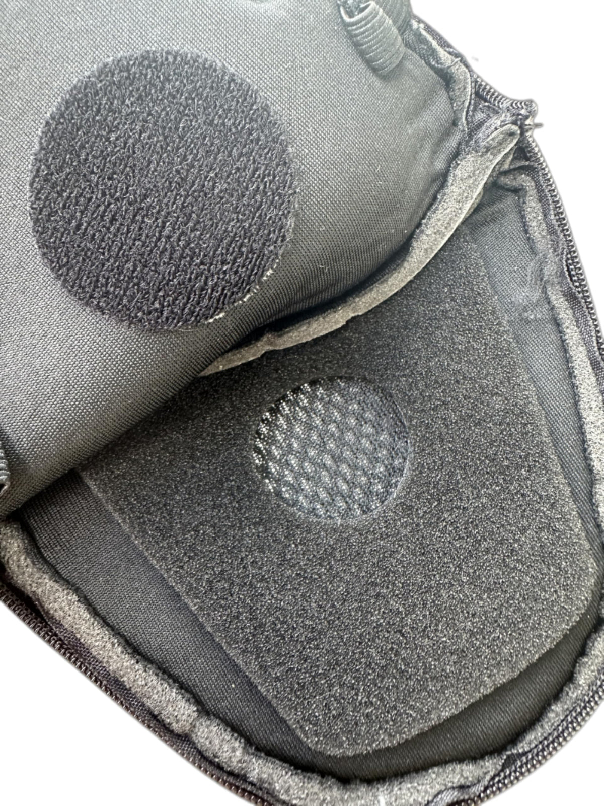The Helmet Shop pocket next to helmet for scale, shows compact footprint benefit