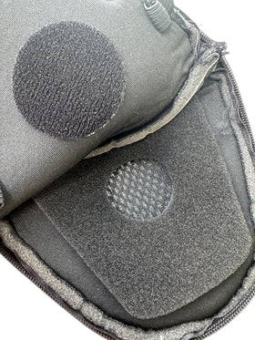 The Helmet Shop pocket next to helmet for scale, shows compact footprint benefit