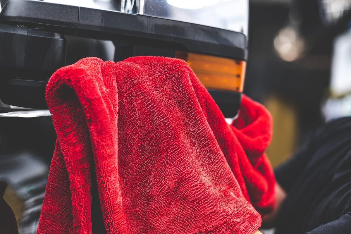 The Rag Company towel holding water demonstrating high absorbency capacity