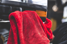 The Rag Company towel holding water demonstrating high absorbency capacity