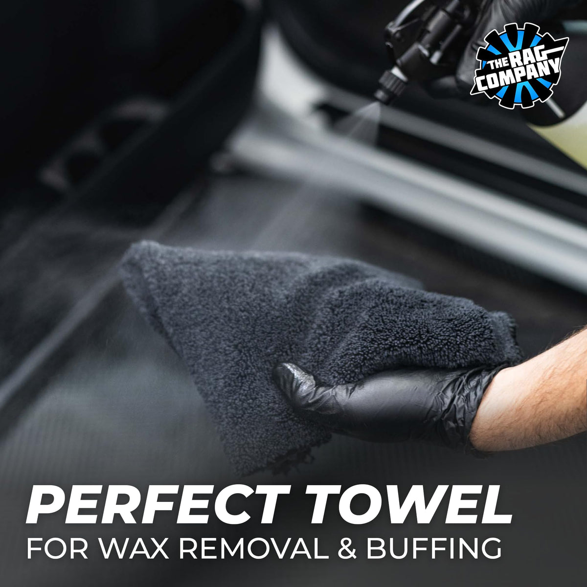 Hand holding The Rag Company towel showing 16x16 size and easy handling benefit