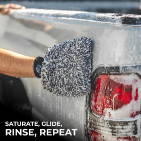 The Rag Company mitt used in driveway wash showing professional finish benefit