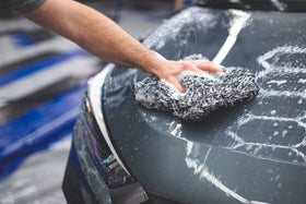 The Rag Company mitt loaded with suds holding lots of wash solution