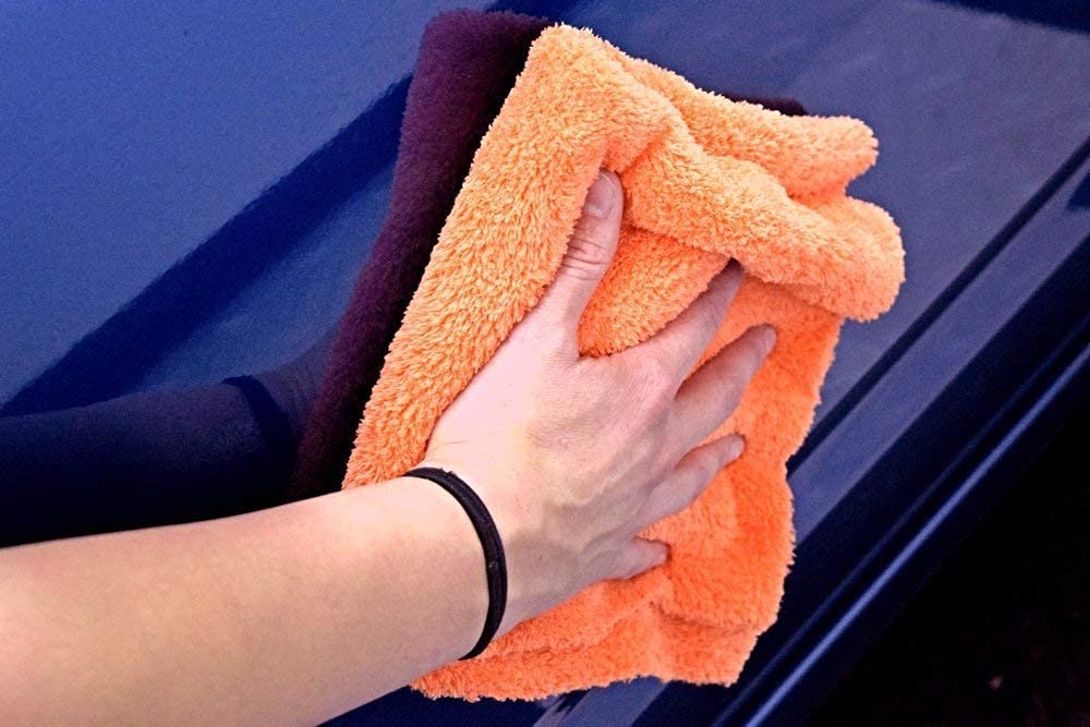 The Rag Company folded towels stored compactly for organized detailing kits