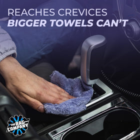 The Rag Company Eaglet 350 towel in hand wiping a mirror for streak-free clarity