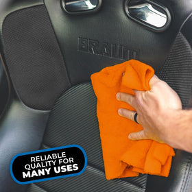 Size comparison with hand showing The Rag Company 16x16 towel for controlled handling
