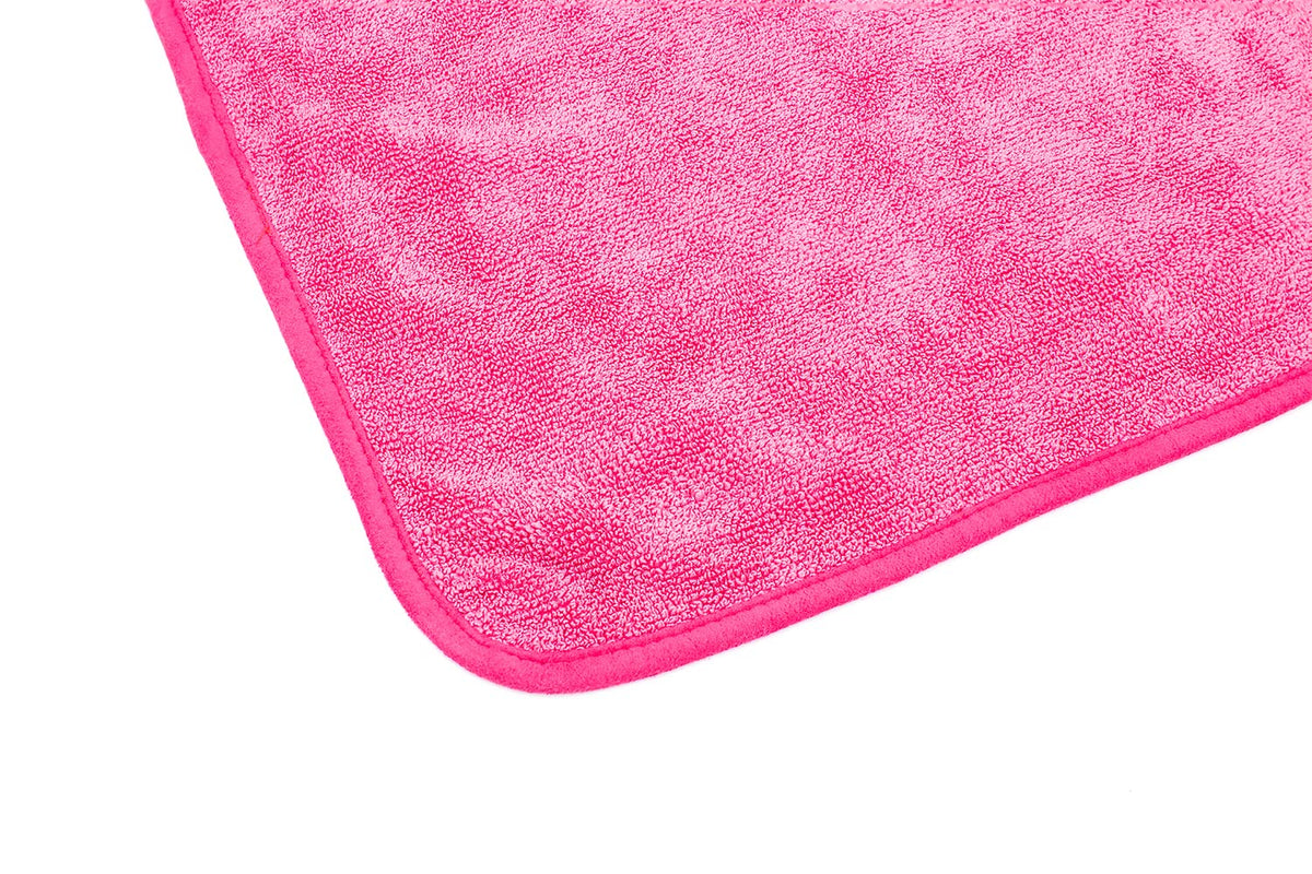 The Rag Company FTW towel cleaning a window leaving streak-free clarity