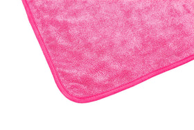 The Rag Company FTW towel cleaning a window leaving streak-free clarity