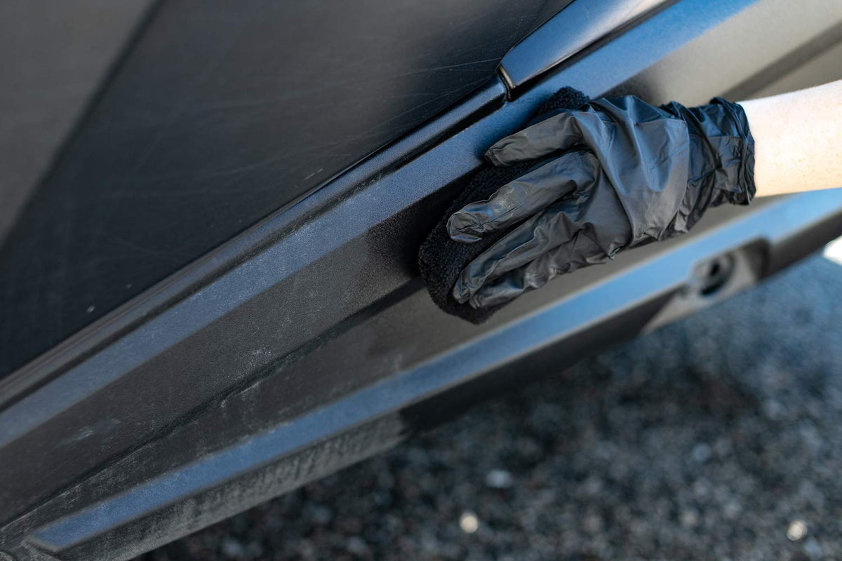 The Rag Company black nitrile gloves pair ready to protect hands during application